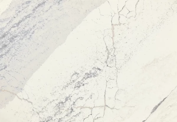 Close-up view of Cambria Windsor Steel Satin Ridge Quartz, showcasing its steel-toned wave patterns, warm honey-colored sand backdrop, and contrasting cool charcoal elements.